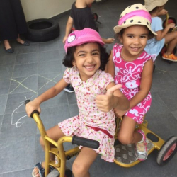 Manya and Lila love playing on the bikes.