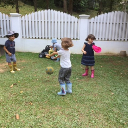 Playing pass the ball in the garden.