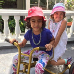 Manya & Kaia on the tricycle.