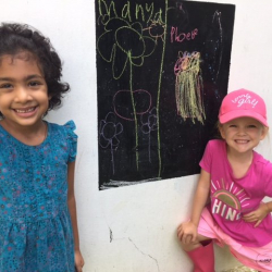 Manya & Phoebe show off their drawings.