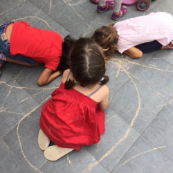Mia, Manya & Eleonore are spider eggs in a web.