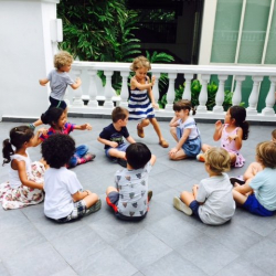 Playing 'duck duck goose'.