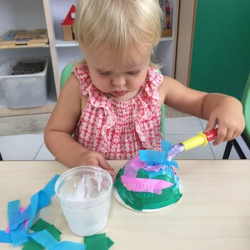 Ella working on her jellyfish craft.