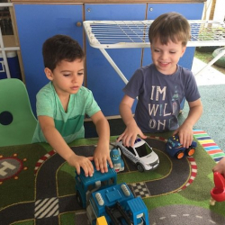 Charlie and Enzo having fun with trucks!