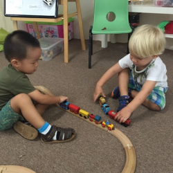 Jeff and Edward playing with trains.