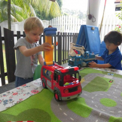 Ethan and Iggy play trucks together