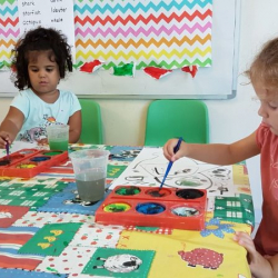 Ana and Zoe doing some colourful painting
