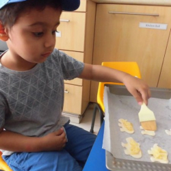Haris concentrates on his cheese puffs!