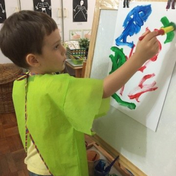 Daniel painting during free time.