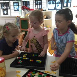 Zoe, Phoebe and Emily problem solving together.