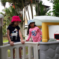 Emily & Anasuya enjoying the new playhouse.