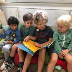Ian reads a story to his friends.