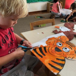 Otto cutting out his tiger.