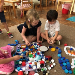 Phoebe, Ottilie & Ethan making patterns:pictures with bottle tops.