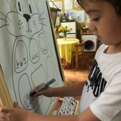 William working on rhyming words ‘at’.
