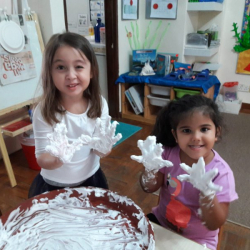 Adinda & Anasuya practise letter formations in shaving foam and of course have fun playing with it!