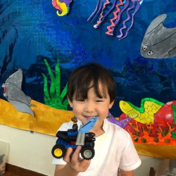 Ethan shows off his lego creation.