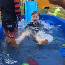 August thoroughly enjoyed the slide in the pool today!