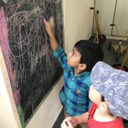 Avaraan doing some creative chalk drawing!