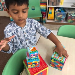 Avraan building his colourful tower!