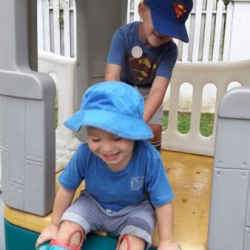Benjamin and Harvey having fun in the playhouse!