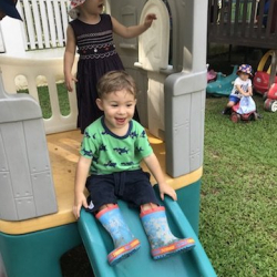 Benjamin having fun on the slide!