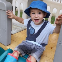 Benjamin having some outdoor fun on the slide!