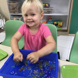 Ella exploring sensory play with water beads!