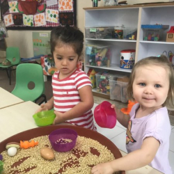 Exploring sensory play with corn kernels!