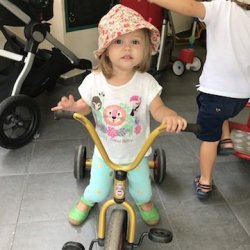 India having fun on the tricycle!