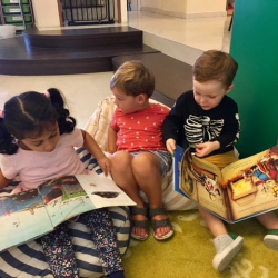 Avyanna, Max, and August checking out the book nook.