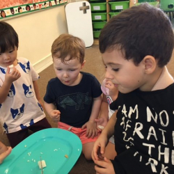 Ethan, August and Enzo enjoying the rice treat with Ms Angie!