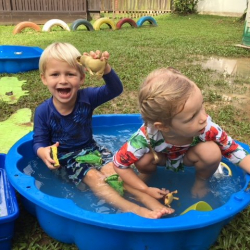 Eddie and Sophie explored the frogs and turtles in the mini pool.