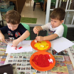 Johnny and August working on their art with chopsticks and cotton balls!