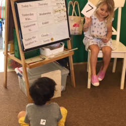 “Teacher Katie” helping Aidan review numbers.