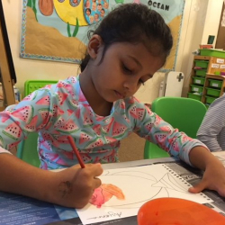 Avyanna worked carefully with watercolors.