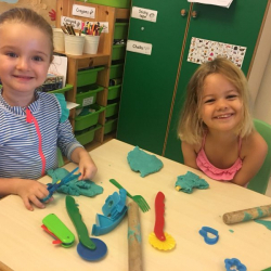 Buddies Matilda and Bella made shapes with play dough.