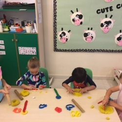 Great cutting and shaping with the play dough.