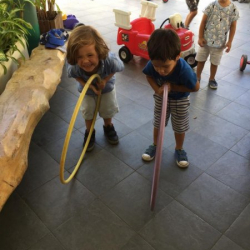 George and Noah, who can roll their hoop the furthest?!