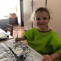 Matilda painting her snowflake.