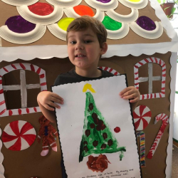 Max showing off his amazing Christmas tree painting