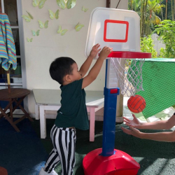 Dudu practicing his Basketball skills with Ms Mel’s son Willam!