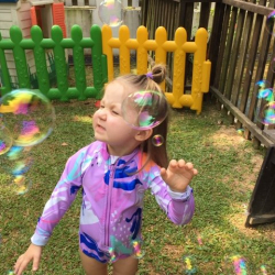 Coco had fun trying to catch bubbles.