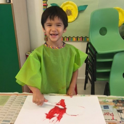 Noah had fun painting with a toothbrush!
