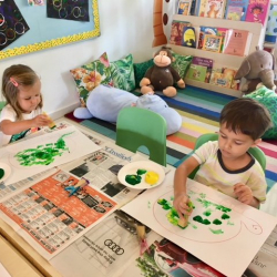 Painting green turtles after listening to the story “Turtle Day”.