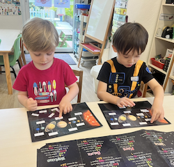 Bingo and Trevor matching the planets to their names .