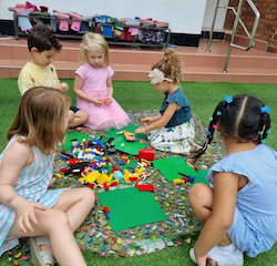 Busy-bees-enjoying-Legos-outdoors-