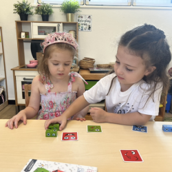 Esme and Elenna enjoying their puzzle work together.