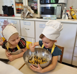 Kate having a great time mixing the cookie mix.