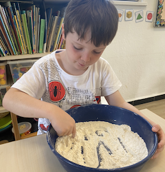 Logan tracing CVC words.